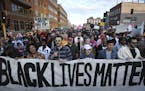 Protesters walked along Washington Avenue during a Black Lives Matter rally on Wednesday, April 29, 2015, in Minneapolis, Minn. ] RENEE JONES SCHNEIDE