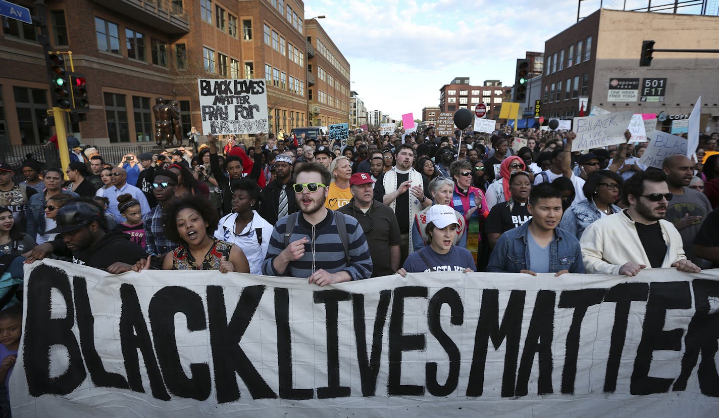 Protesters walked along Washington Avenue during a Black Lives Matter rally on Wednesday, April 29, 2015, in Minneapolis, Minn. ] RENEE JONES SCHNEIDER &#x2022; reneejones@startribune.com ORG XMIT: MIN1504292207262084