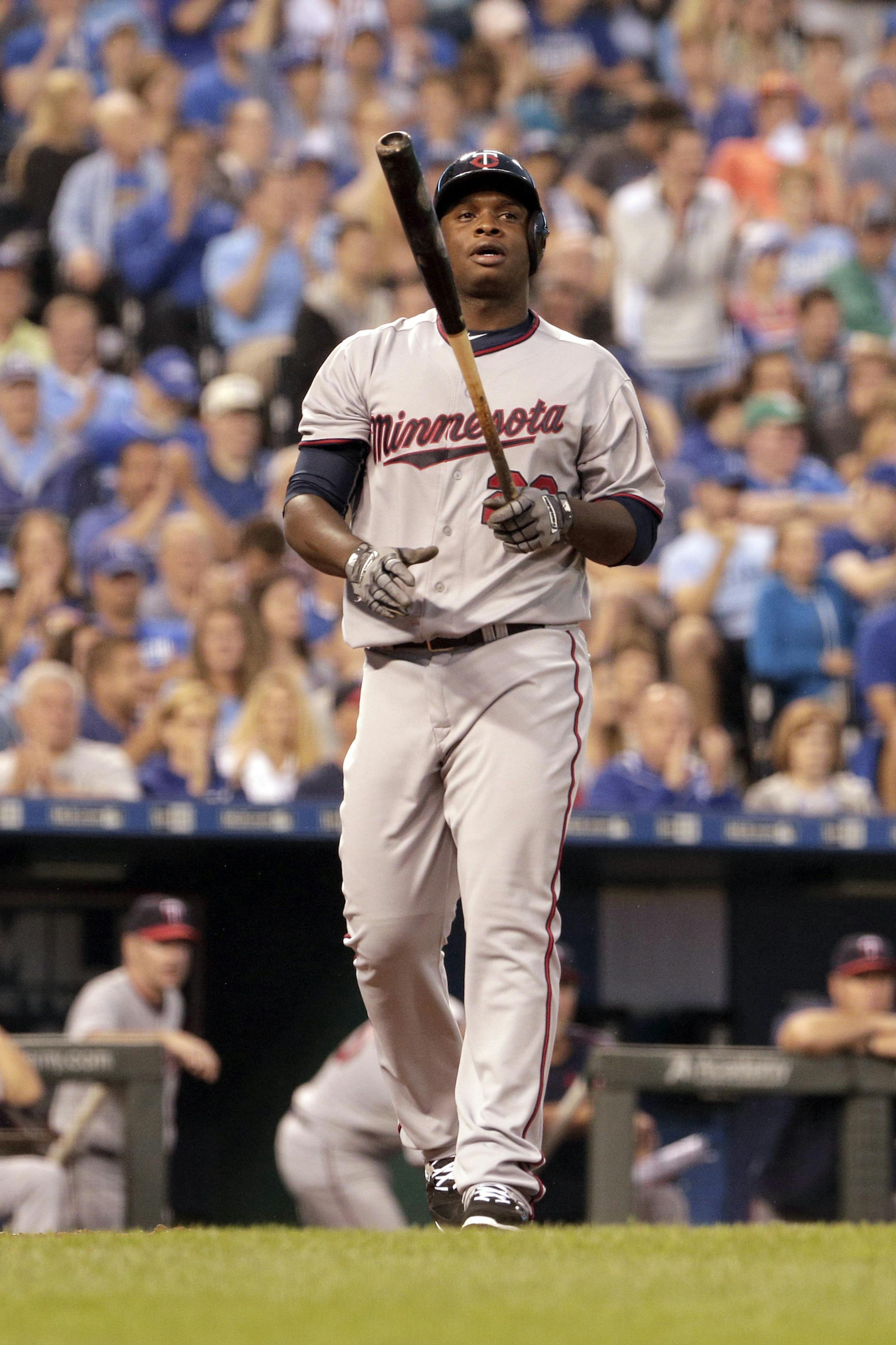 Minnesota Twins' Miguel Sano walks off after striking out during the eighth inning of a baseball game against the Kansas City Royals Thursday, July 2, 2015, in Kansas City, Mo. (AP Photo/Charlie Riedel) ORG XMIT: OTKCR ORG XMIT: MIN1603051956440022