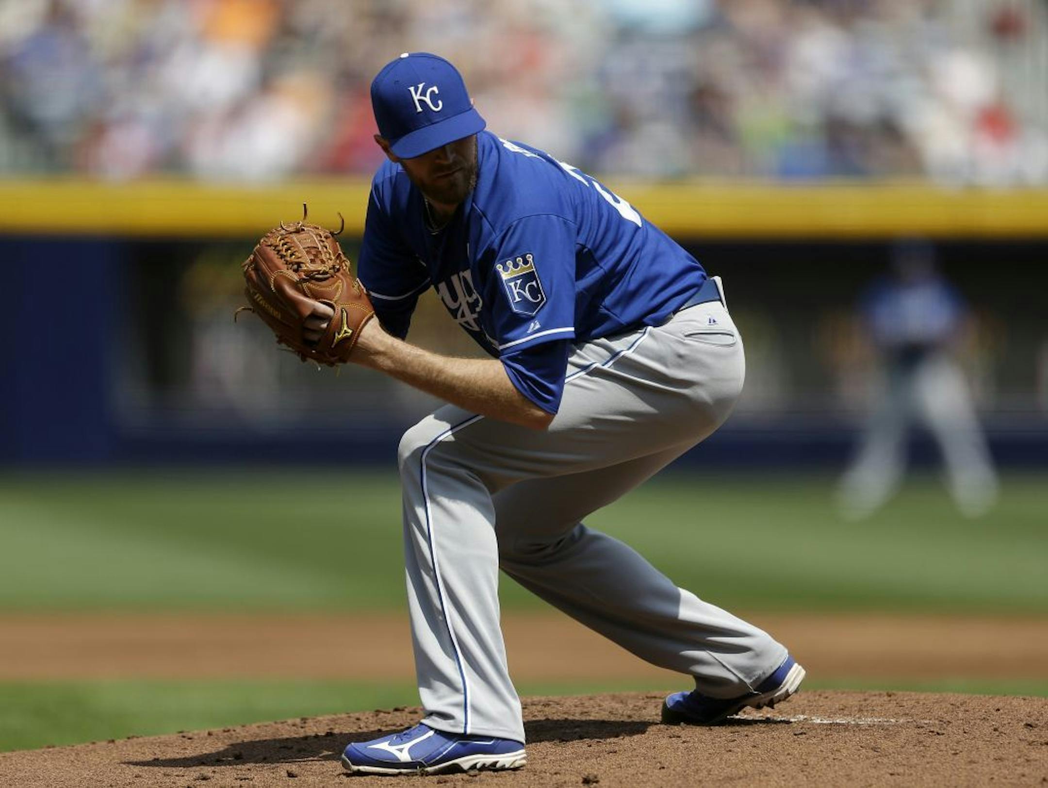 Kansas City Royals starting pitcher Wade Davis prepares to throw in the first inning of a baseball game against the Atlanta Braves, Wednesday, April 17, 2013, in Atlanta.