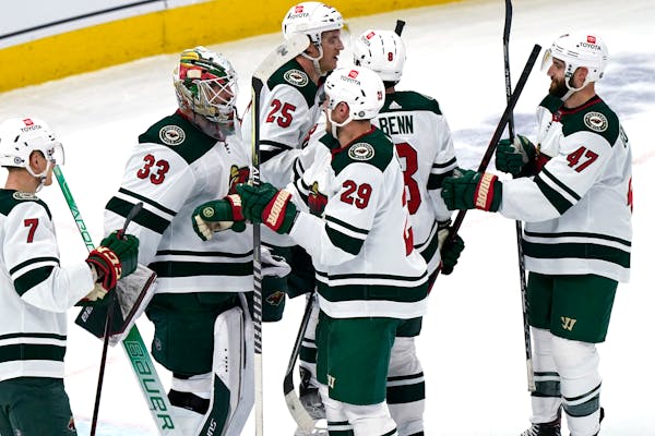 Wild players celebrated with goalie Cam Talbot after Wednesday’s 5-0 victory in Chicago, the team’s sixth consecutive win.