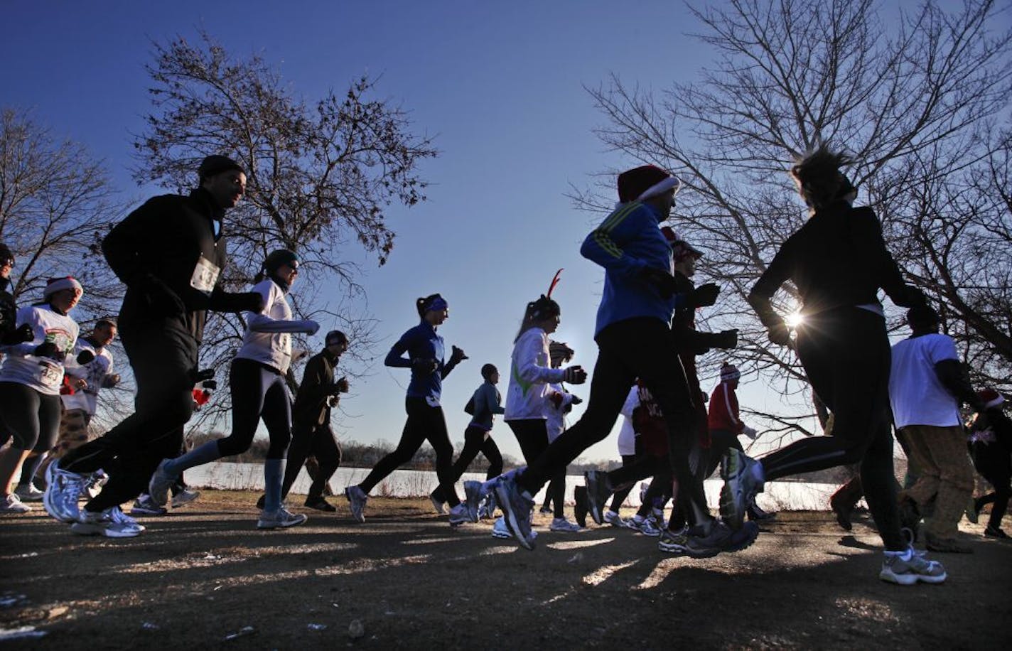 Under unusually warm, sunny skies runners made their way around Como Lake Sunday, Dec. 25, 2011 in St. Paul, during the Christmas Day - Joyful 5K run.