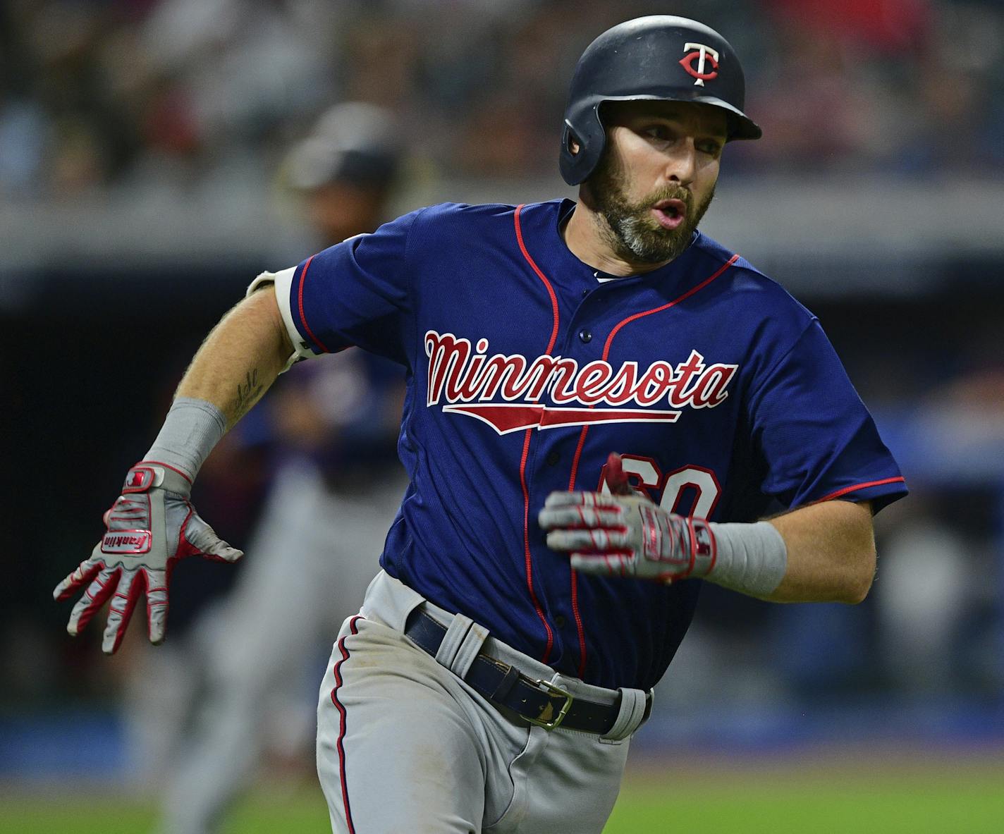 Minnesota Twins' Jake Cave runs after hitting a two-RBI double in the eighth inning of a baseball game against the Cleveland Indians, Saturday, July 13, 2019, in Cleveland. (AP Photo/David Dermer)