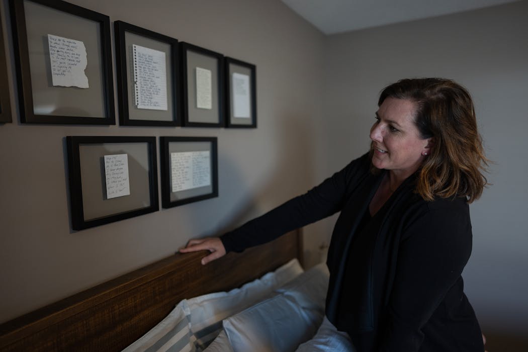 Some of Kristin Rortvedt's favorite poems from her husband hang above their bed at their home in Brooklyn Park.