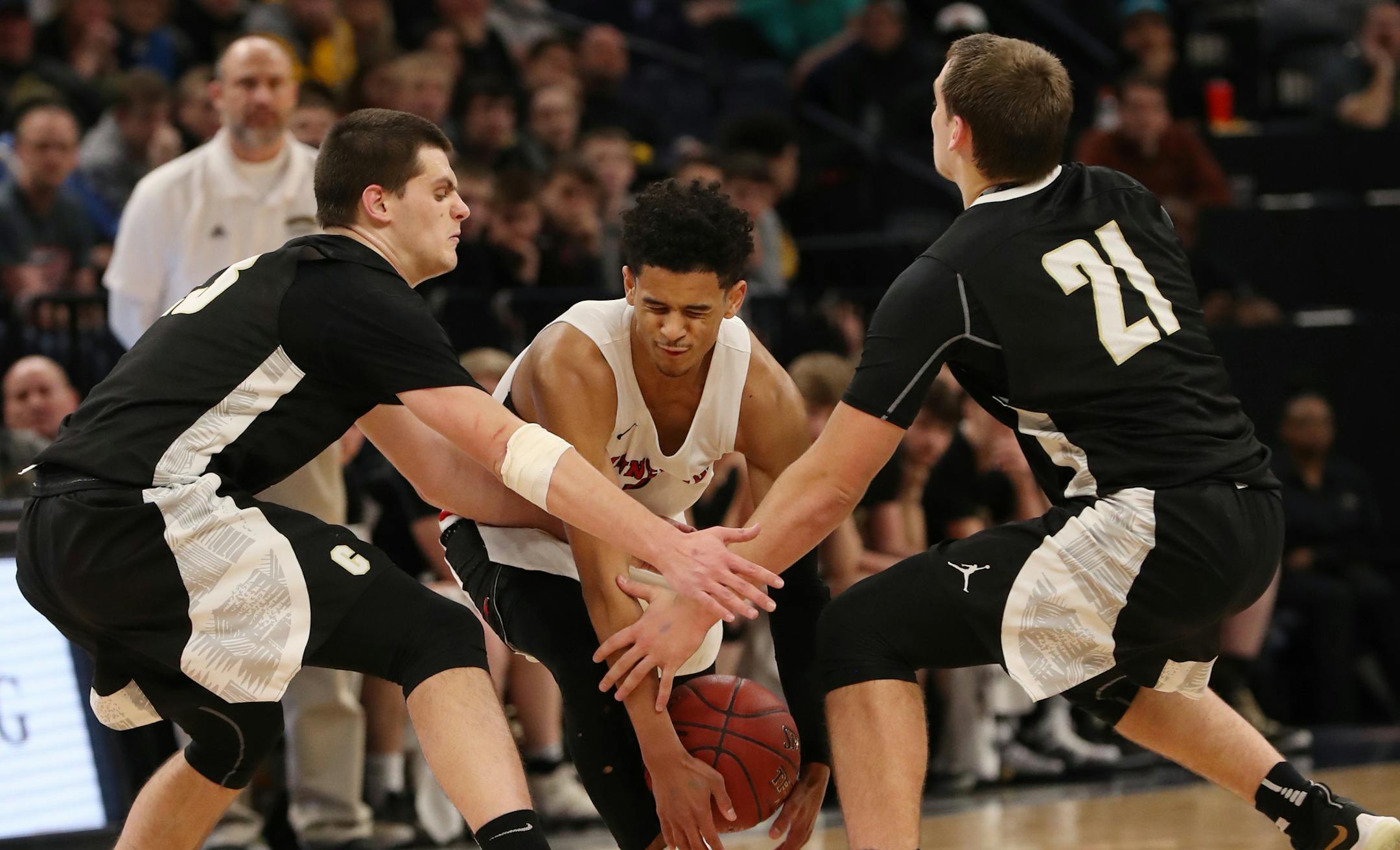 Minnehaha Academy's Terry Lockett tried to split the Caledonia defense of Owen King (left) and Noah King (right). ] Shari L. Gross ï shari.gross@startribune.com Class 2A championship: Minnehaha Academy defeated Caledonia 73-60.