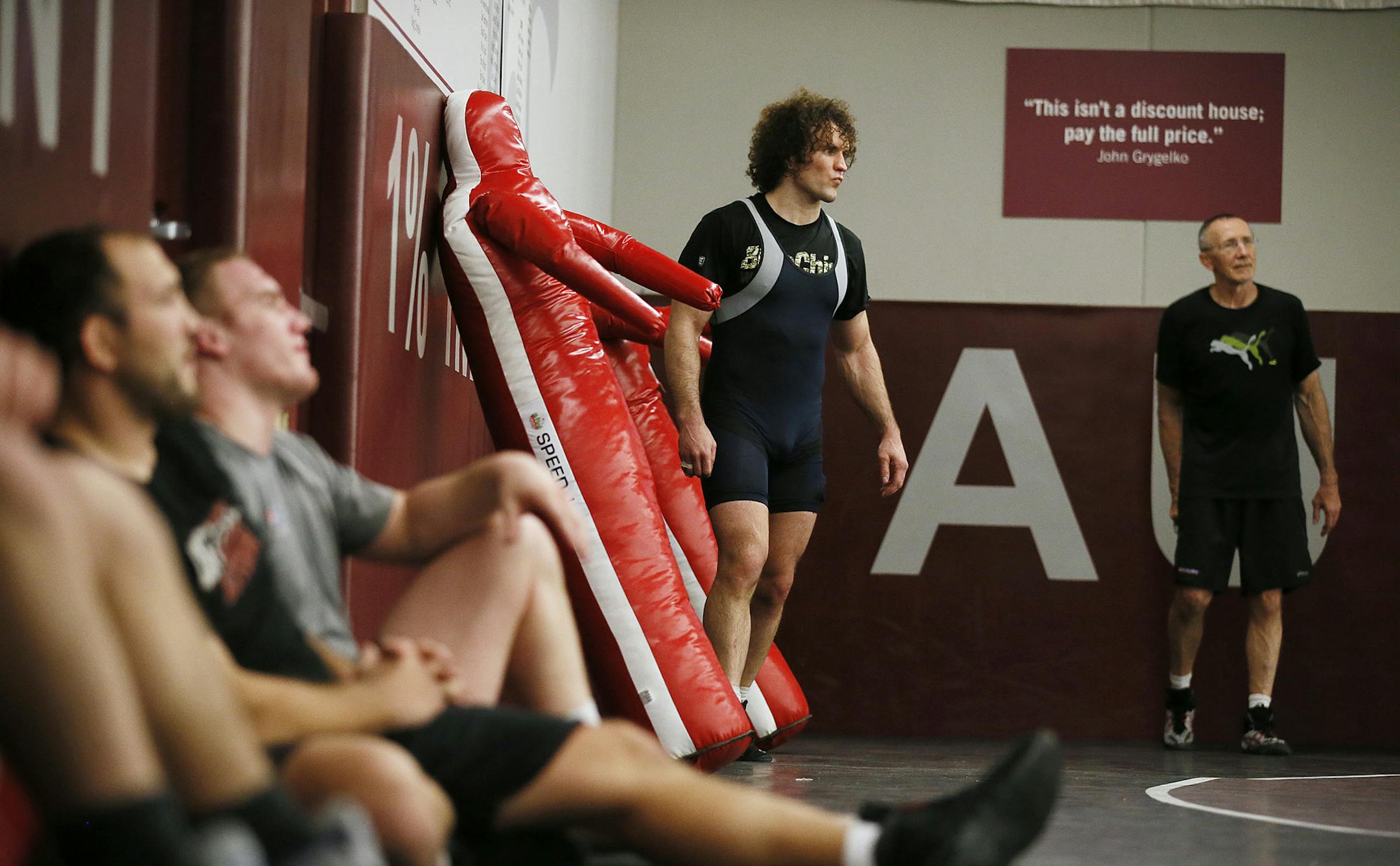 Coach Dan Chandler right and Jordan Holm lead a wrestling workout at Augsburg College Tuesday May 27, 2013 in Minneapolis , MN. Wrestling faces an important vote Wednesday as it tries to remain an Olympic sport. An International Olympic Committee board will decide whether to recommend that it be part of the 2020 Olympics. The sport's leaders have mounted a huge campaign to save it, including rule changes and a leadership shakeup. Minneapolis coach Dan Chandler, a three-time Olympian, helped shap
