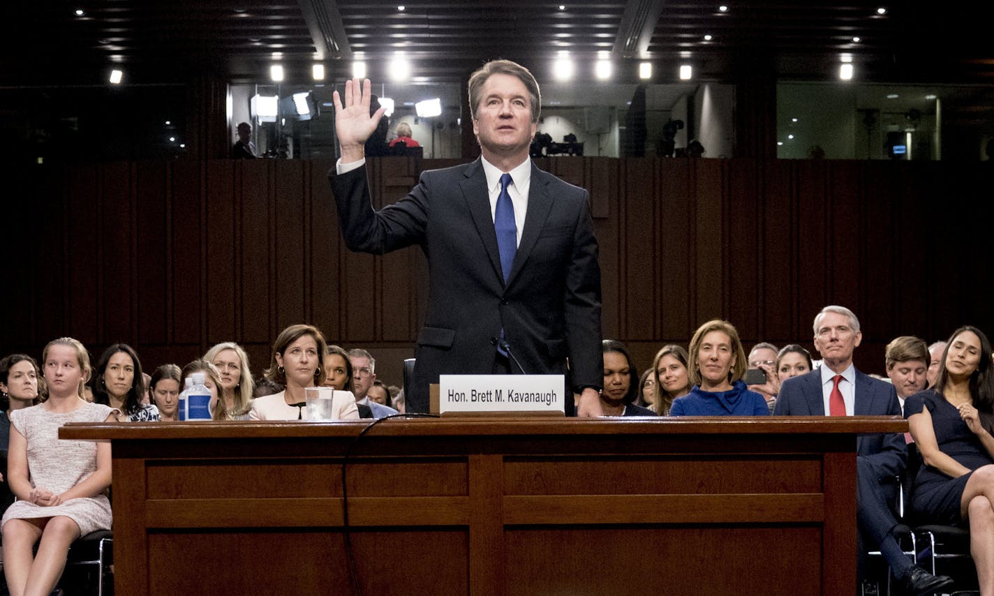 President Donald Trump's Supreme Court nominee Brett Kavanaugh is sworn-in before the Senate Judiciary Committee on Capitol Hill in Washington, Tuesday, Sept. 4, 2018, to begin his testimony in his confirmation hearing to replace retired Justice Anthony Kennedy. (AP Photo/Andrew Harnik)