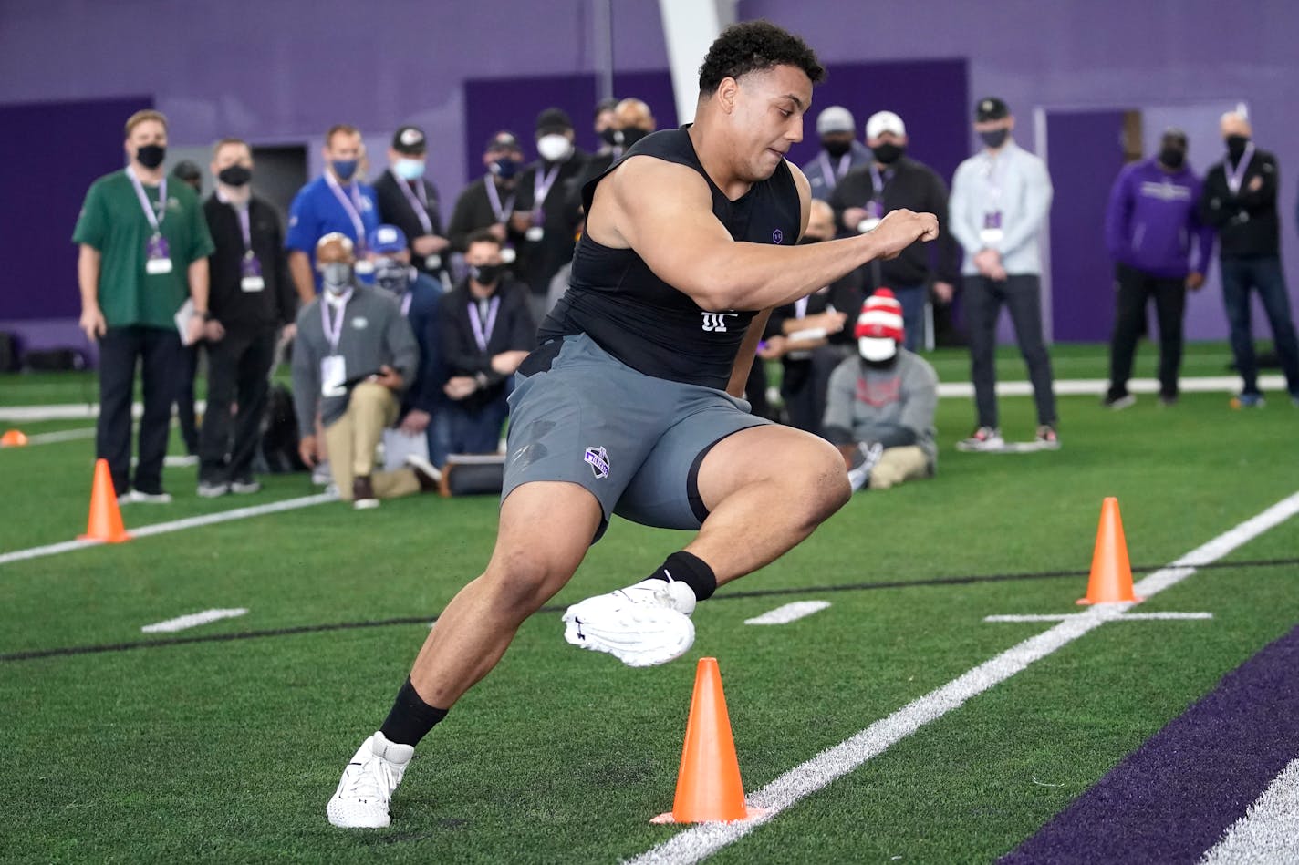 FILE - Northwestern offensive lineman Rashawn Slater, participates in the school's Pro Day football workout for NFL scouts Tuesday, March 9, 2021, in Evanston, Ill. The acquisition of Sam Darnold via trade earlier this month has given the Carolina Panthers more options with the No. 8 pick in the NFL draft. Carolina's most pressing need entering the draft is at left tackle, a position they have failed to solidify over the last seven seasons. (AP Photo/Charles Rex Arbogast, File)