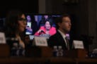 Sen. Amy Klobuchar, D-Minn., is seen on a screen behind X’s Linda Yaccarino and Meta’s Mark Zuckerberg at a Senate Judiciary Committee hearing on 
