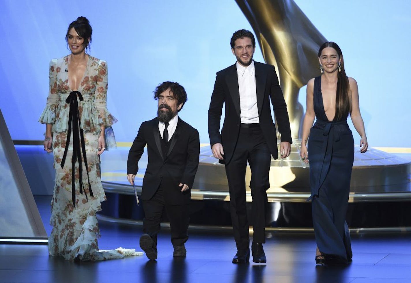 Lena Headey, from left, Peter Dinklage, Kit Harington and Emilia Clarke, of the cast of "Game of Thrones," appear on stage to present the award for outstanding supporting actress in a limited series or movie at the 71st Primetime Emmy Awards on Sunday, Sept. 22, 2019, at the Microsoft Theater in Los Angeles.