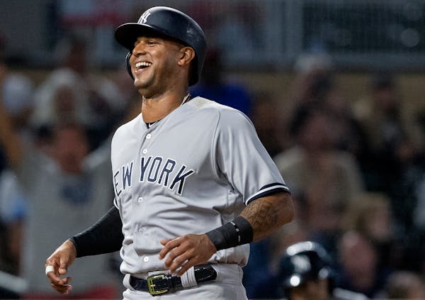 Aaron Hicks smiled as he scored a run in the seventh inning Monday night for the Yankees vs. the Twins.