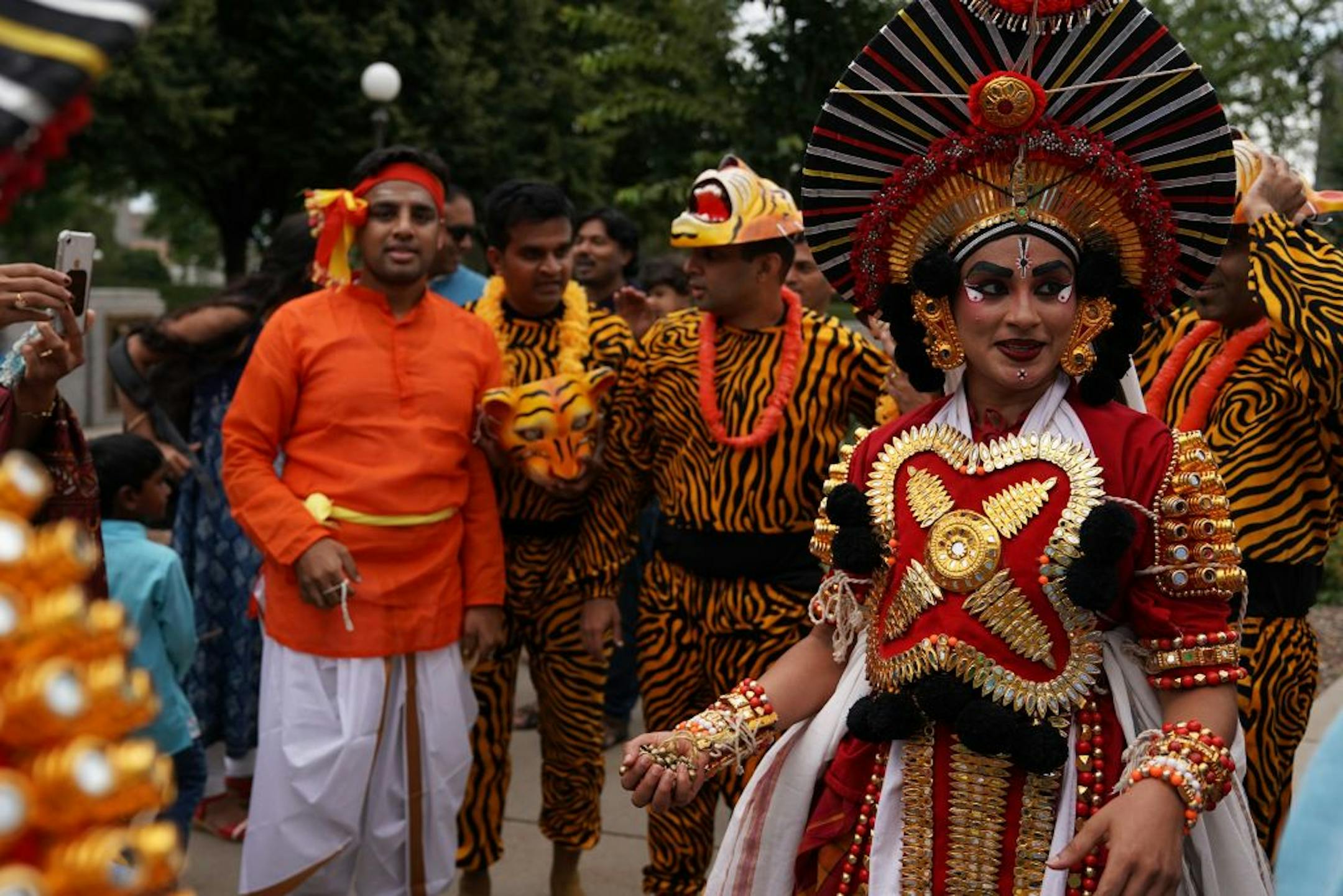 Spectators gathered to see the dancers as they waited off stage between performances during IndiaFest Saturday.