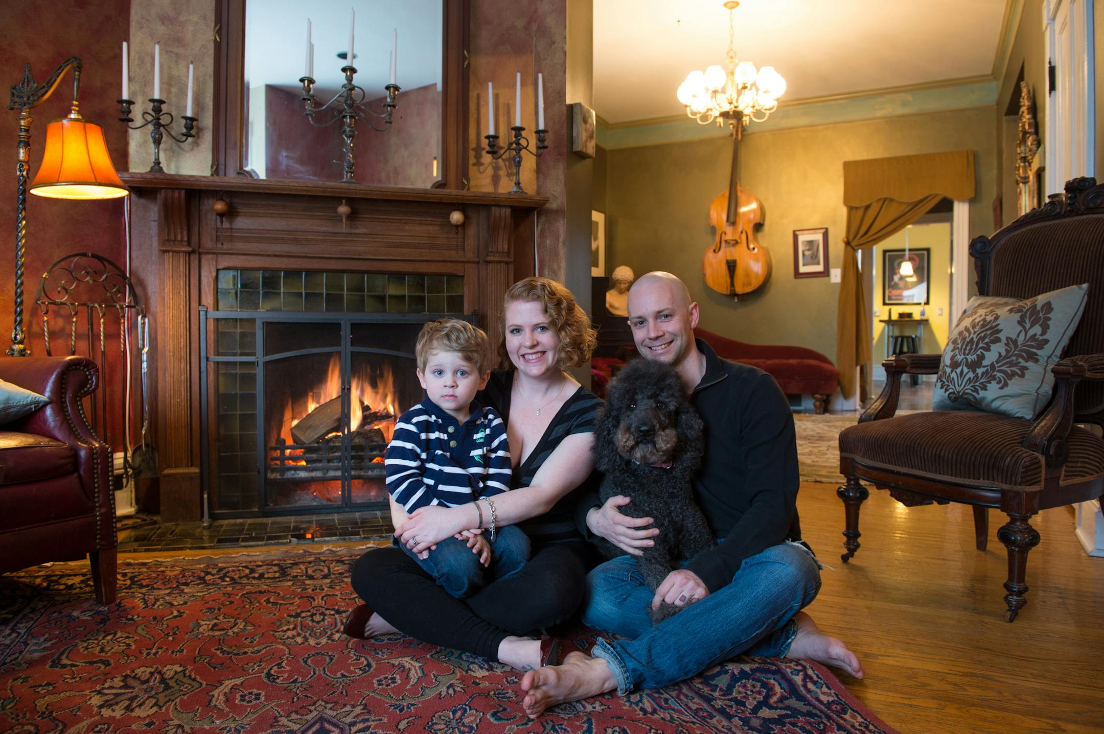 Katie and Jason Swanson wih Lochlan in their restored St. Paul home on the Mpls. St. Paul Home tour. Credit Scott Amundson