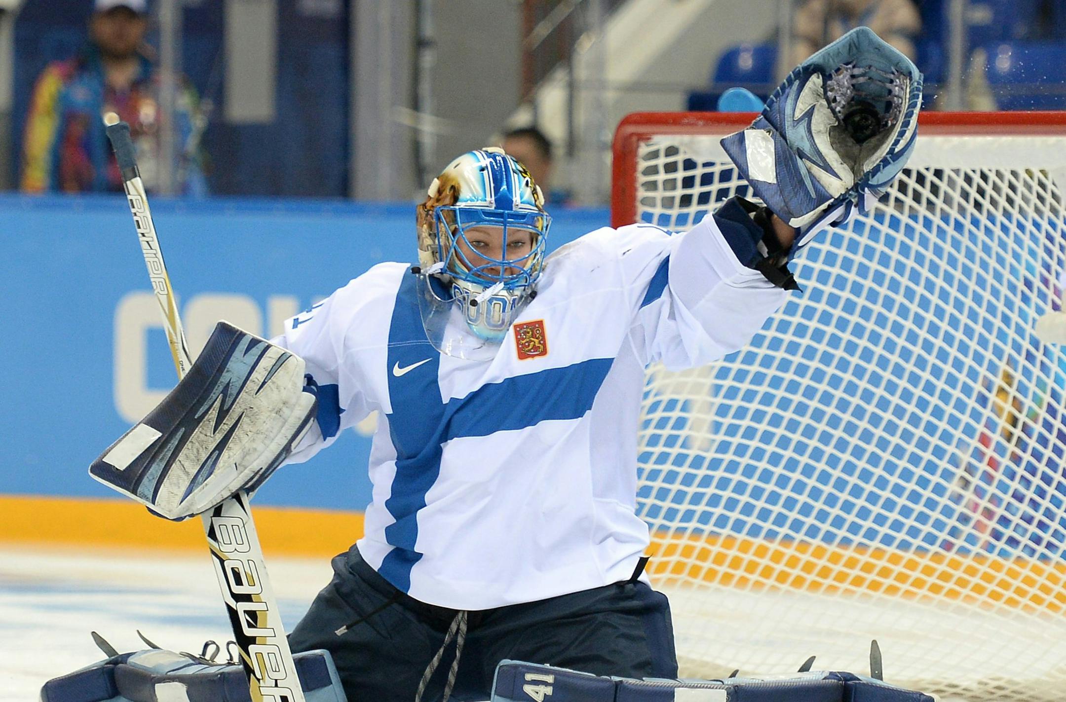 Finland goalie Noora Raty (41) makes a high glove save against Sweden in the second period of a women's hockey quarter-final game at Shayba Arena during the Winter Olympics in Sochi, Russia, Saturday, Feb. 15, 2014. Sweden defeated Finland, 3-2. (Chuck Myers/MCT) ORG XMIT: 1149207
