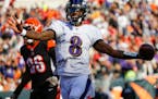 Baltimore Ravens quarterback Lamar Jackson (8) celebrates his touchdown during the second half of NFL football game against the Cincinnati Bengals, Su