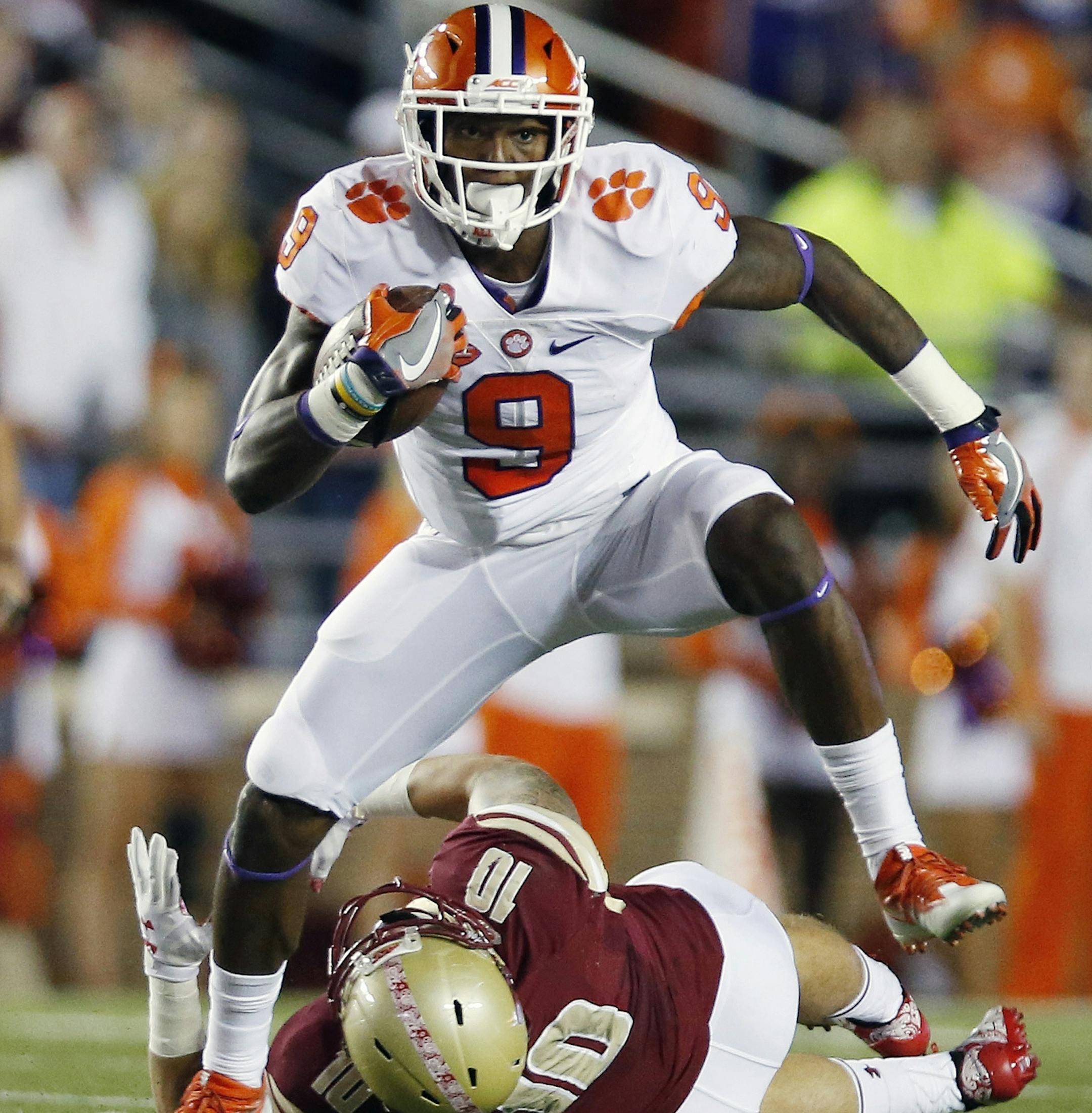 Clemson running back Wayne Gallman (9) gets past Boston College linebacker Ty Schwab (10) on a touchdown run during the first quarter of an NCAA college football game in Boston, Friday, Oct. 7, 2016. (AP Photo/Michael Dwyer)