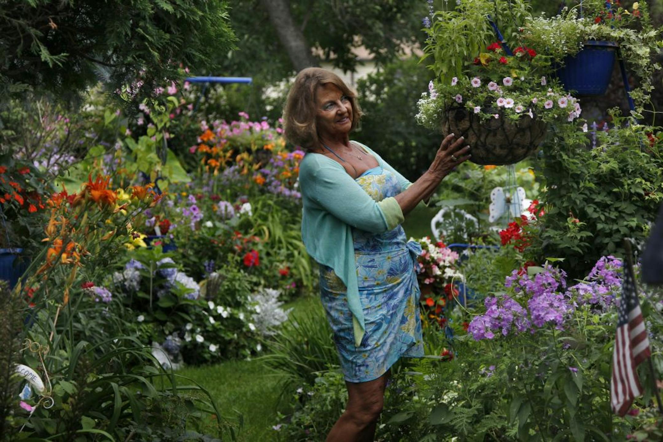Judy Alm takes great care in all aspects of the outdoor garden space around her home. She was one of the winners of the 2011 Home & Garden Beautiful Gardens contest. [ TOM WALLACE • twallace@startribune.com _ Assignments # 20019066A_ August, 2 2011_ SLUG: jones0210_ EXTRA INFORMATION: