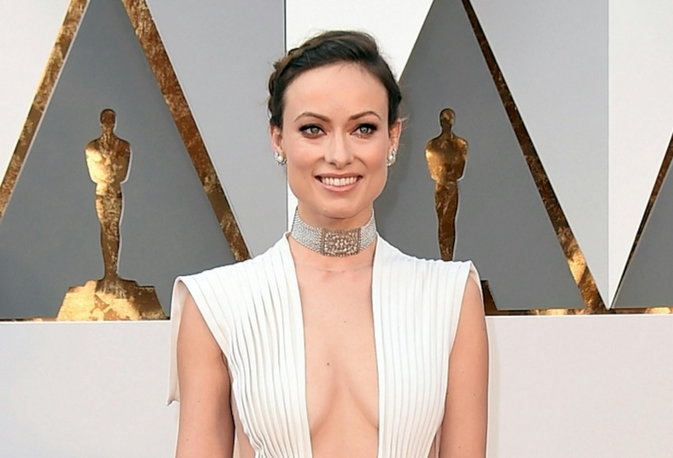 Olivia Wilde arrives at the Oscars on Sunday, Feb. 28, 2016, at the Dolby Theatre in Los Angeles.