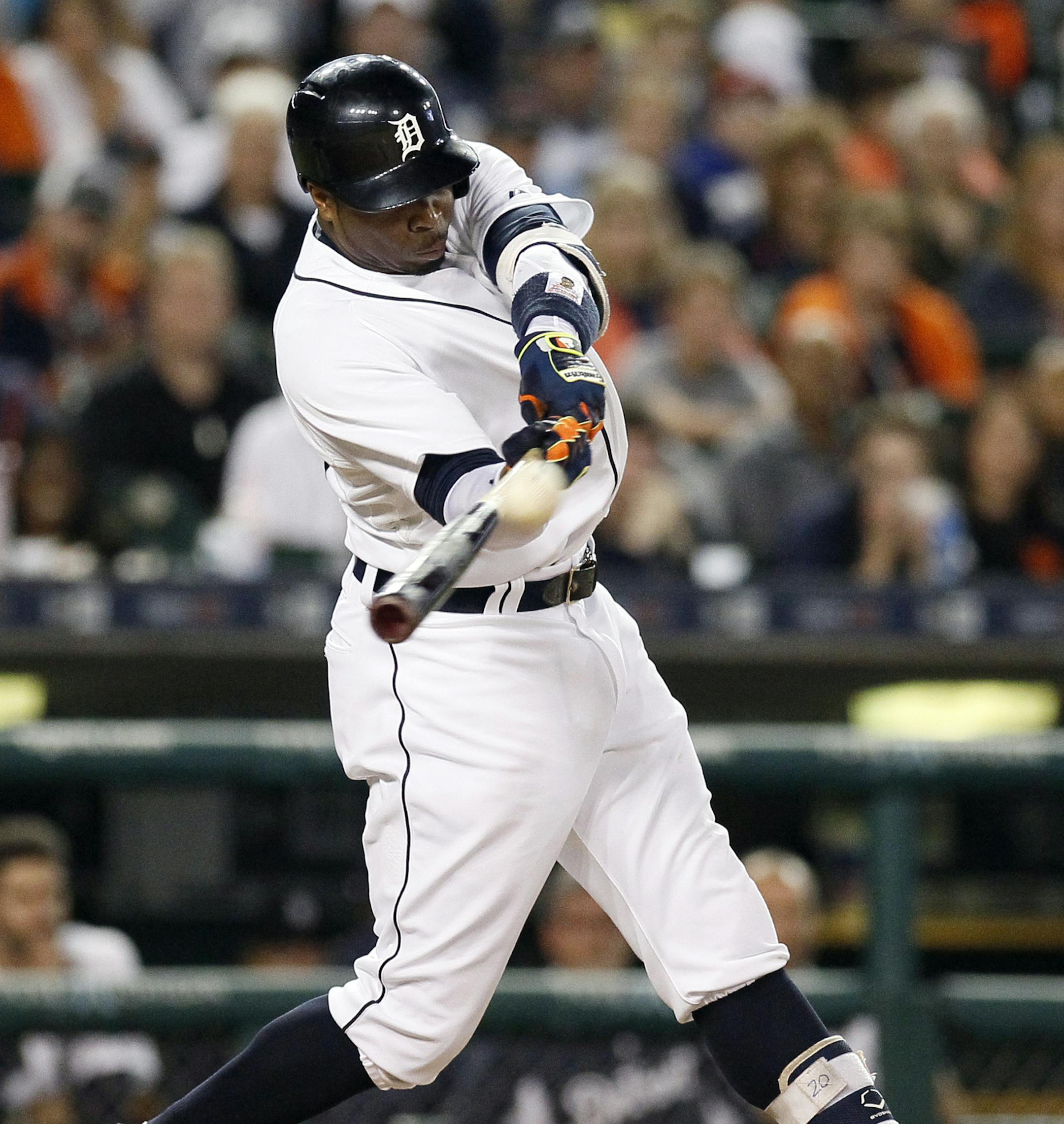 Detroit Tigers' Rajai Davis hits a two-run home run against the Detroit Tigers during the eighth inning during a baseball game against the Minnesota Twins at Comerica Park, Friday, Sept. 25, 2015, in Detroit. (AP Photo/Duane Burleson)