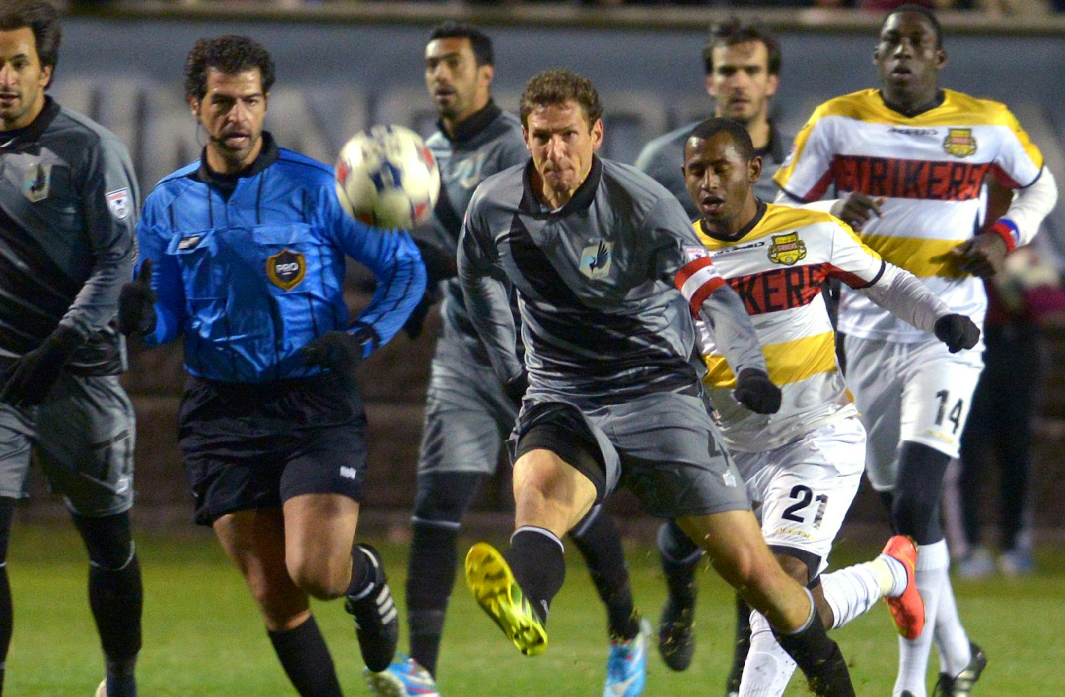 Minnesota United captain Aaron Pitchkolan pushes the ball up the field last season.