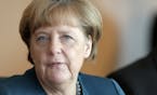 German Chancellor Angela Merkel speaks as she arrives for the weekly cabinet meeting in Berlin, Germany, Wednesday, Nov. 4, 2015. (AP Photo/Michael So