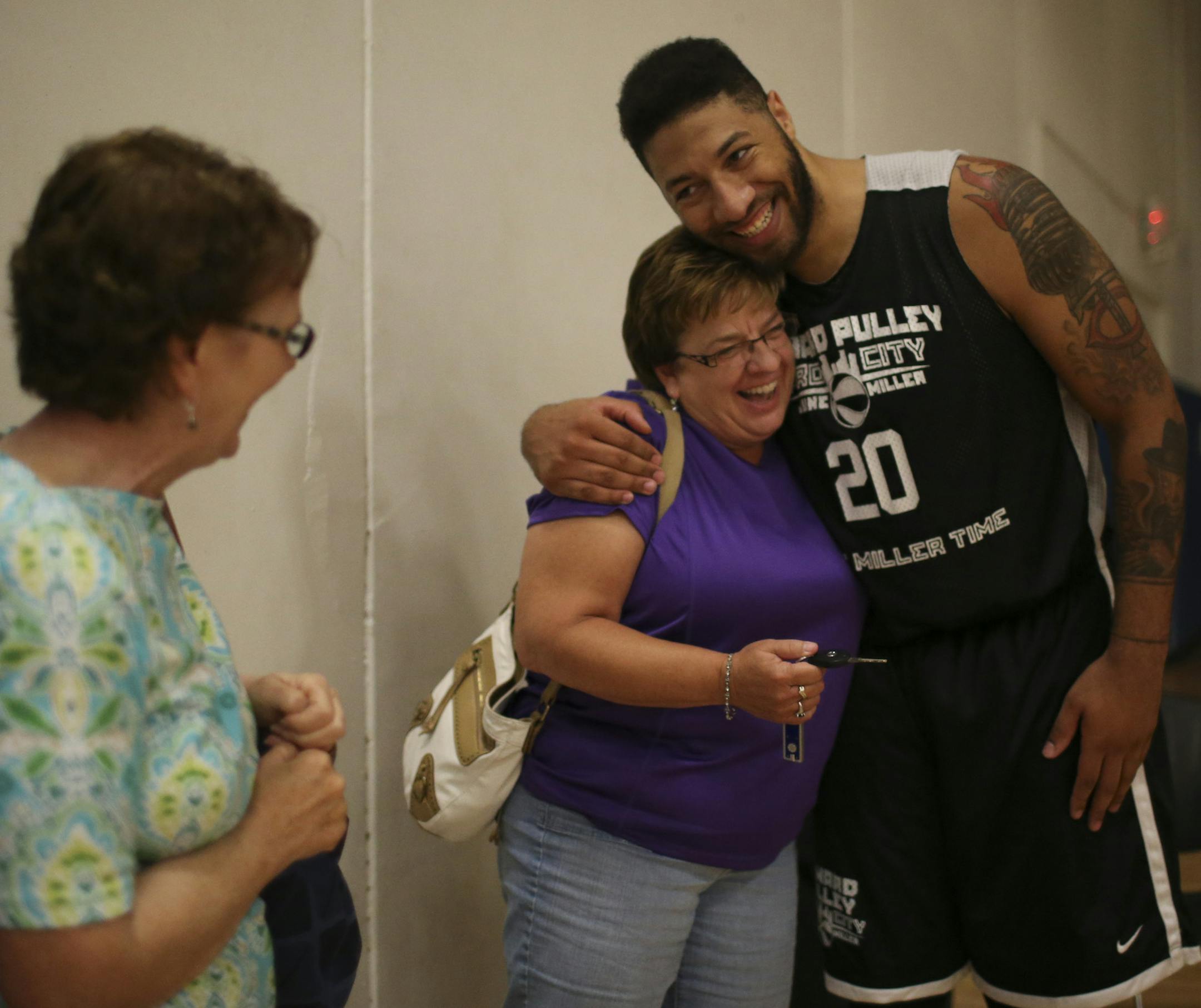 Former Hopkins standout and current NBA player now with the Philadelphia 76ers played in a Howard Pulley Basketball League game Monday night, July 15, 2013 at High Performance Academy in Eagan. Royce White greeted Pat Gallatin with a big hug after his game Monday night. At left was Ginny Krey. Both are longtime friends of White's grandmother, Sandy Pryor, and have known White since he was a baby. A big baby they were quick to point out.] JEFF WHEELER ‚Ä¢ jeff.wheeler@startribune