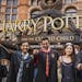 College students in Hogwarts garb who got their tickets as graduation gifts wait to see "Harry Potter and the Cursed Child" on the play's first night 