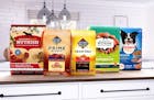 Post Consumer Brands is seeing "trading down" from its higher-end brands like Nutrish and Nature's Recipe as shoppers seek deals amid rapid pet food i