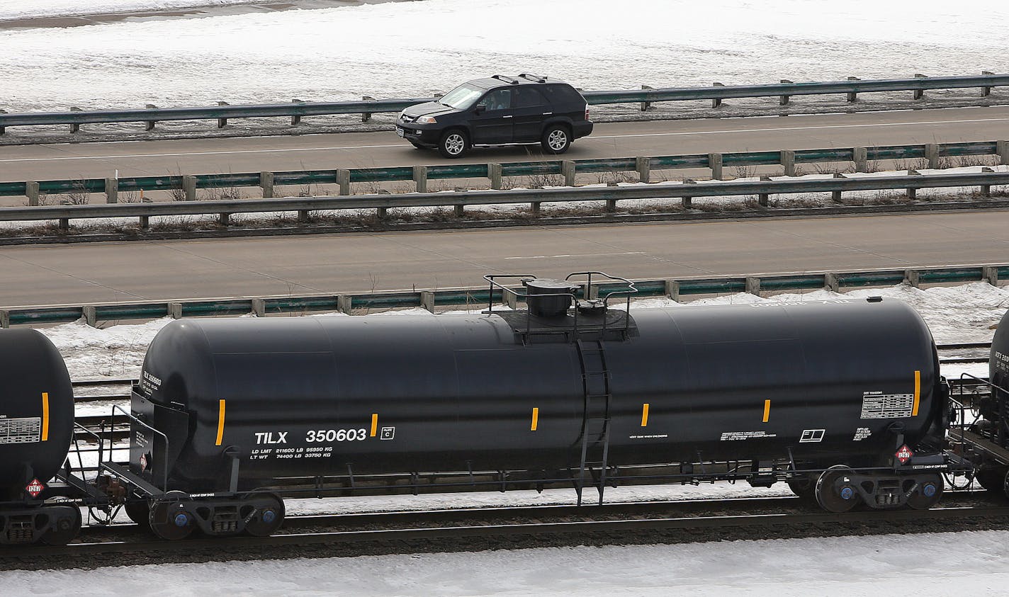 This crude-carrying car moved along Warner Road near the Mississippi River.