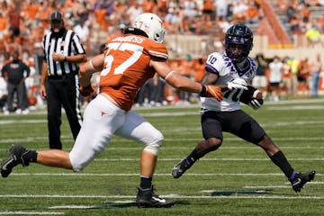 JD Spielman (10) ran around Texas linebacker Cort Jaquess (57) during the first half of a TCU game on Oct. 3, 2020.