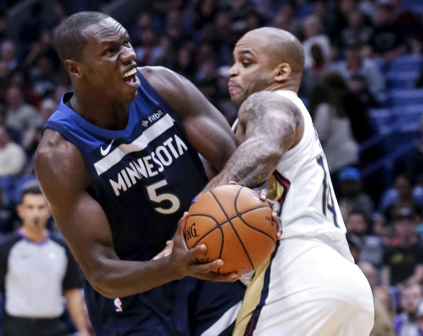 Minnesota Timberwolves center Gorgui Dieng (5) faces New Orleans Pelicans guard Jameer Nelson (14) in the second half of an NBA basketball game in New Orleans, Wednesday, Nov. 1, 2017. (AP Photo/Scott Threlkeld)