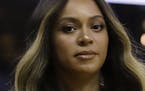 FILE - In this Wednesday, June 5, 2019, file photo, Beyonce walks to her seat during the first half of Game 3 of basketball's NBA Finals between the G