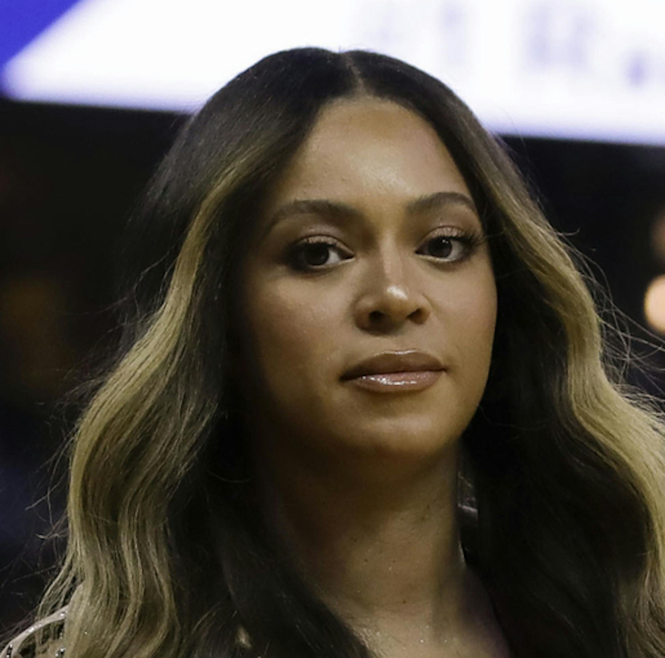 FILE - In this Wednesday, June 5, 2019, file photo, Beyonce walks to her seat during the first half of Game 3 of basketball's NBA Finals between the Golden State Warriors and the Toronto Raptors in Oakland, Calif. Beyoncé did not let Juneteenth 2020 pass without dropping one of her signature surprises in the form a new single called "Black Parade." The singer's website says the song released late Friday, June 19, 2020, will benefit black-owned small businesses. (AP Photo/Ben Margot, File)