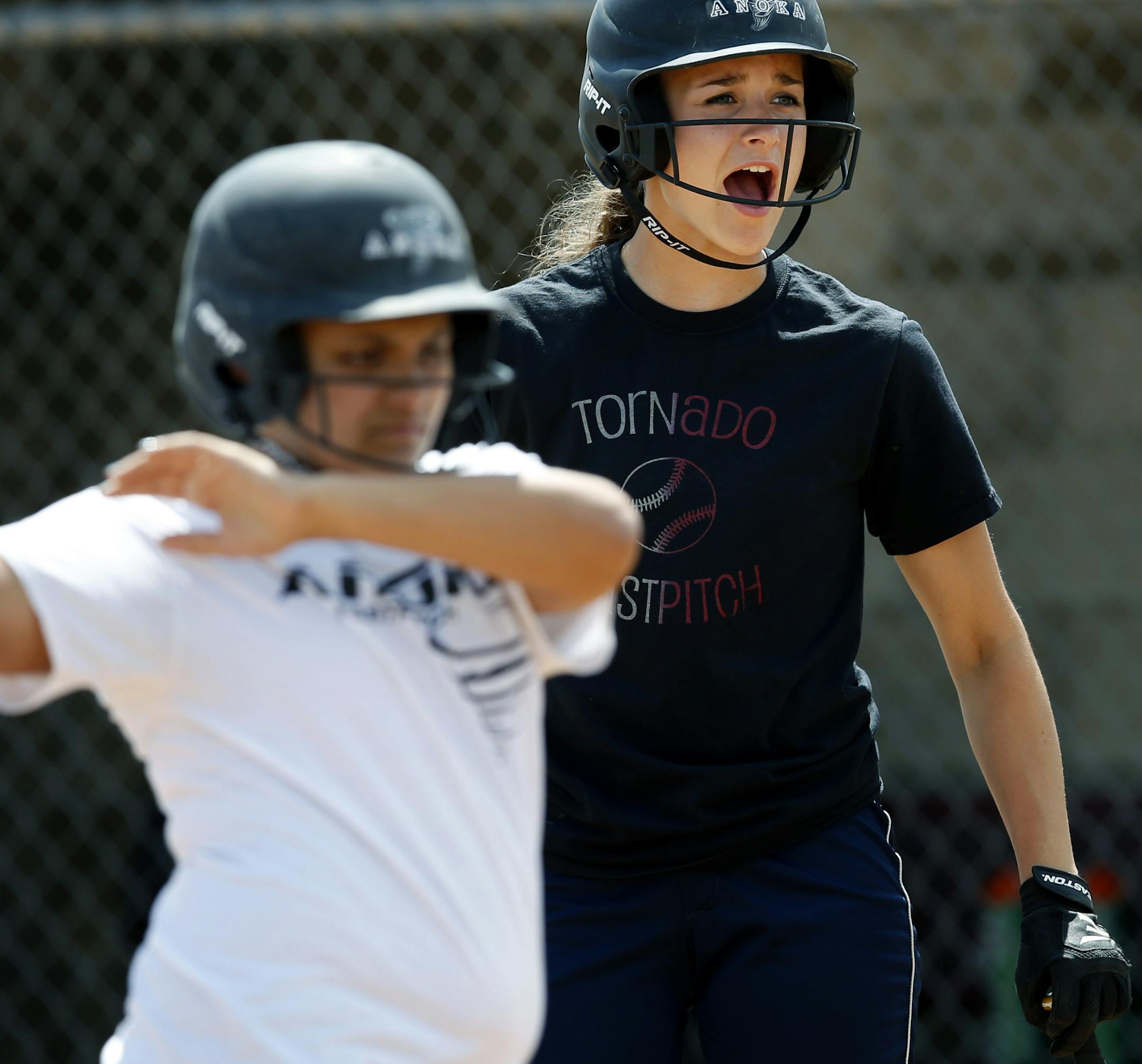 Anoka High School softball players Dayja Rosario and Megan Lindenfelser during practice on Monday. ] CARLOS GONZALEZ cgonzalez@startribune.com - June 2, 2014, Anoka, Minn., Anoka girls softball has qualified for its first ever state tournament.