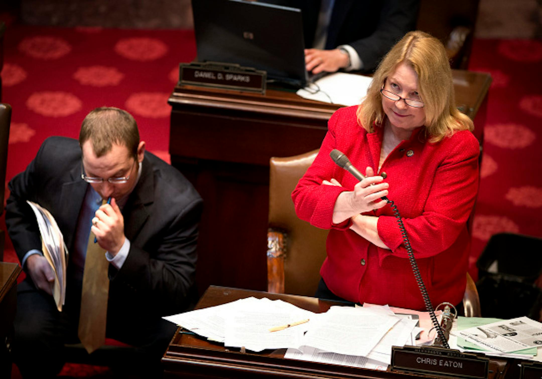 DFL researcher Craig Janezich stood ready to help Sen Chris Eaton as she defended her minimum wage bill from questions and amendments on the Senate floor.    Wednesday, May 8, 2013     ]   GLEN STUBBE * gstubbe@startribune.com