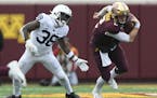 Minnesota Gophers quarterback Tanner Morgan (2) rushed the ball past Penn State Nittany Lions safety Lamont Wade (38). ] Aaron Lavinsky &#x2022; aaron