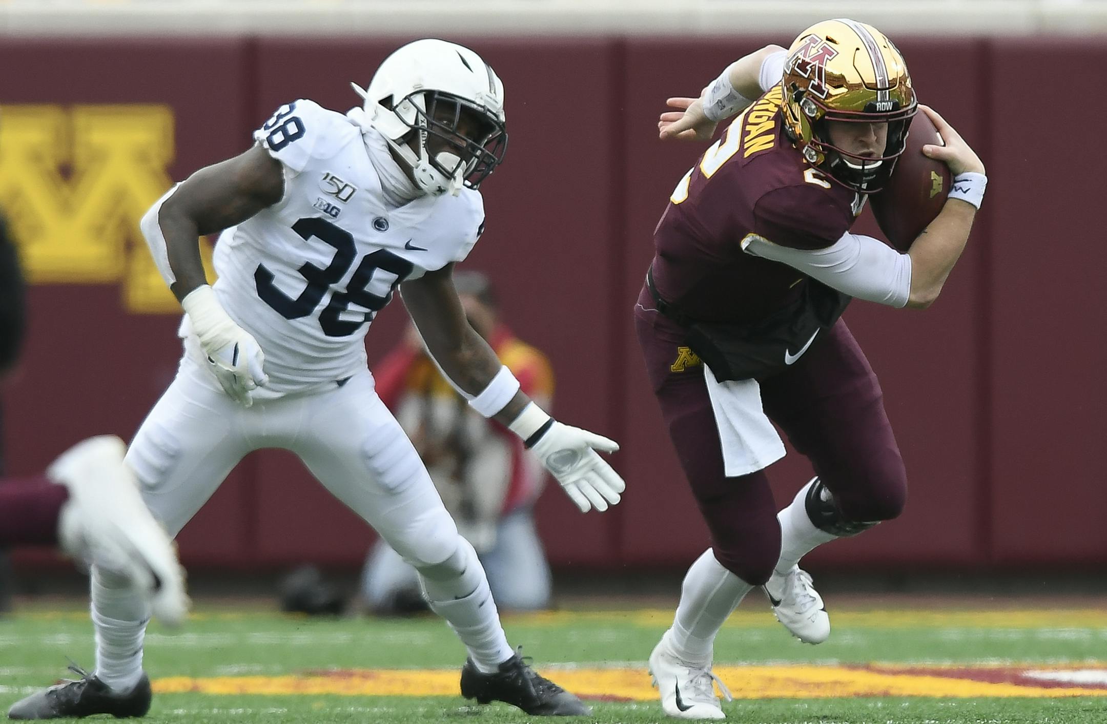 Minnesota Gophers quarterback Tanner Morgan (2) rushed the ball past Penn State Nittany Lions safety Lamont Wade (38). ] Aaron Lavinsky • aaron.lavinsky@startribune.com The Minnesota Gophers played the Penn State Nittany Lions on Saturday, Nov. 9, 2019 at TCF Bank Stadium in Minneapolis, Minn.