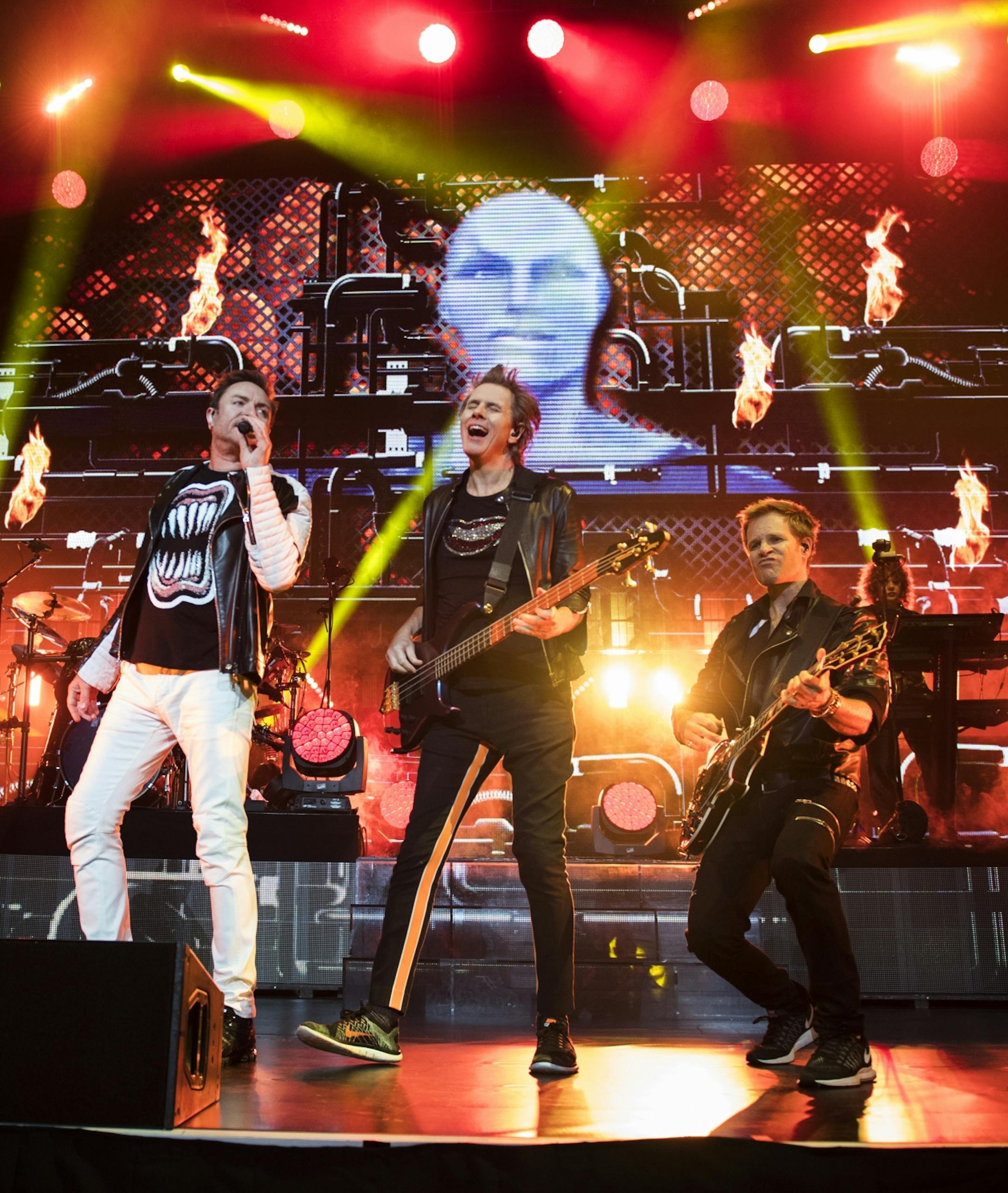 From left, Simon Le Bon, John Taylor and Dominic Brown performed with the rest of Duran Duran at the Xcel Energy Center on Saturday night.