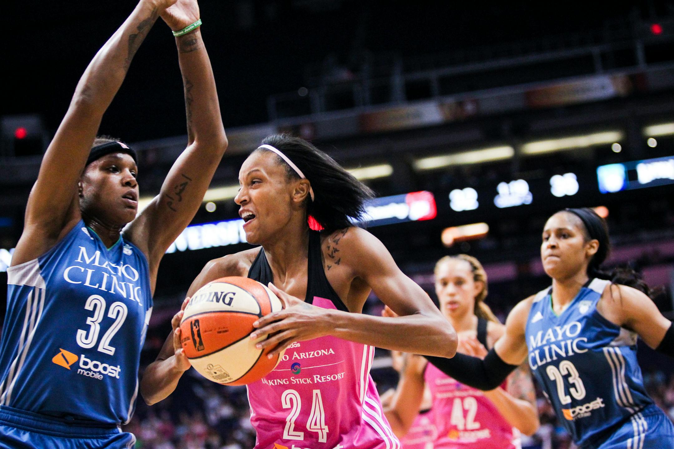 Phoenix Mercury forward DeWanna Bonner (24) goes up for a shot as Minnesota Lynx forward Rebekkah Brunson (32) defends during a WNBA basketball game Friday, Aug. 7, 2015, in Phoenix. (Isaac Hale/The Arizona Republic via AP)