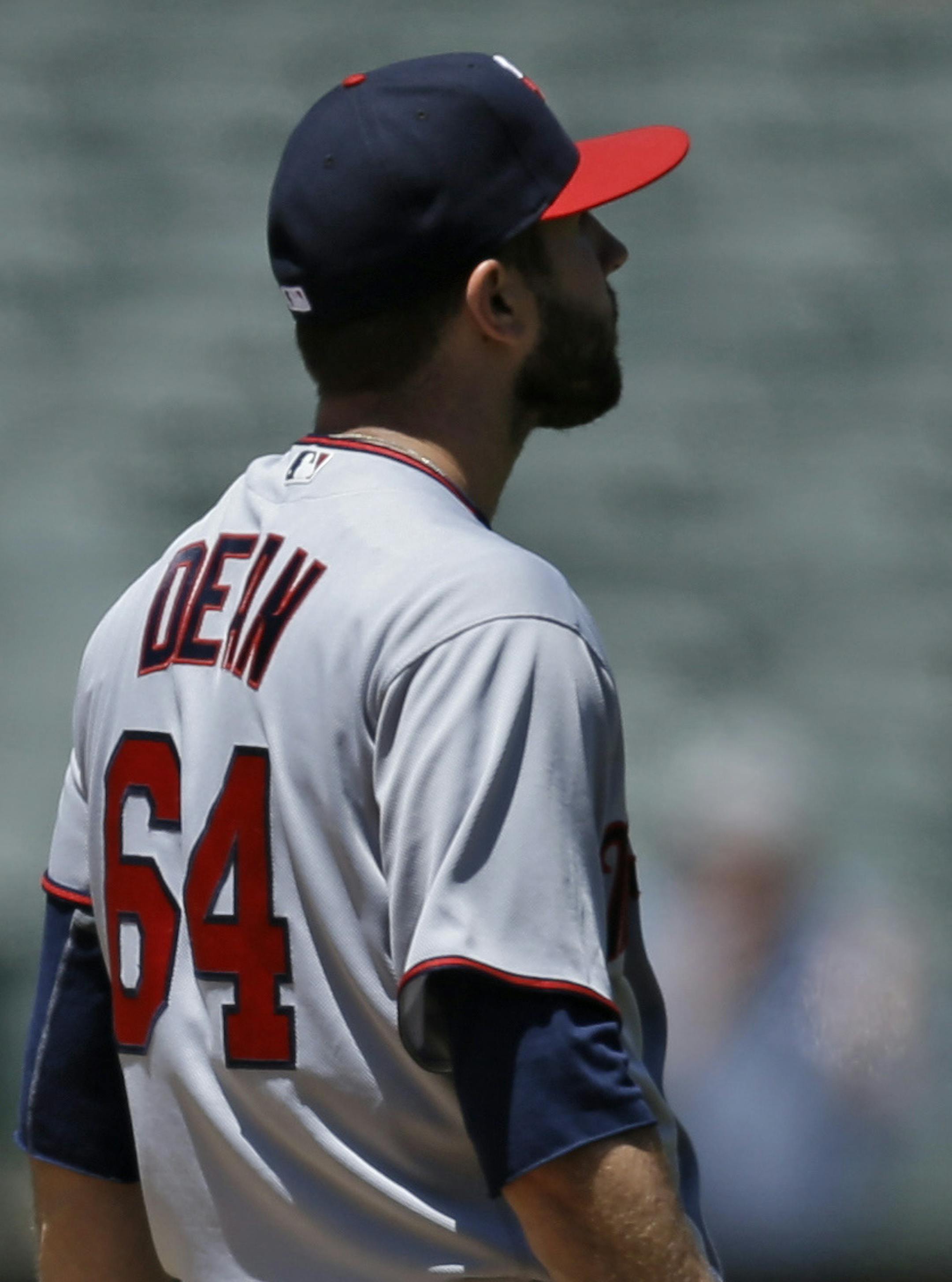 Minnesota Twins pitcher Pat Dean, right, waits for Oakland Athletics' Jake Smolinski, left, to run the bases after hitting a home run in the fourth inning of a baseball game Wednesday, June 1, 2016, in Oakland, Calif. (AP Photo/Ben Margot)