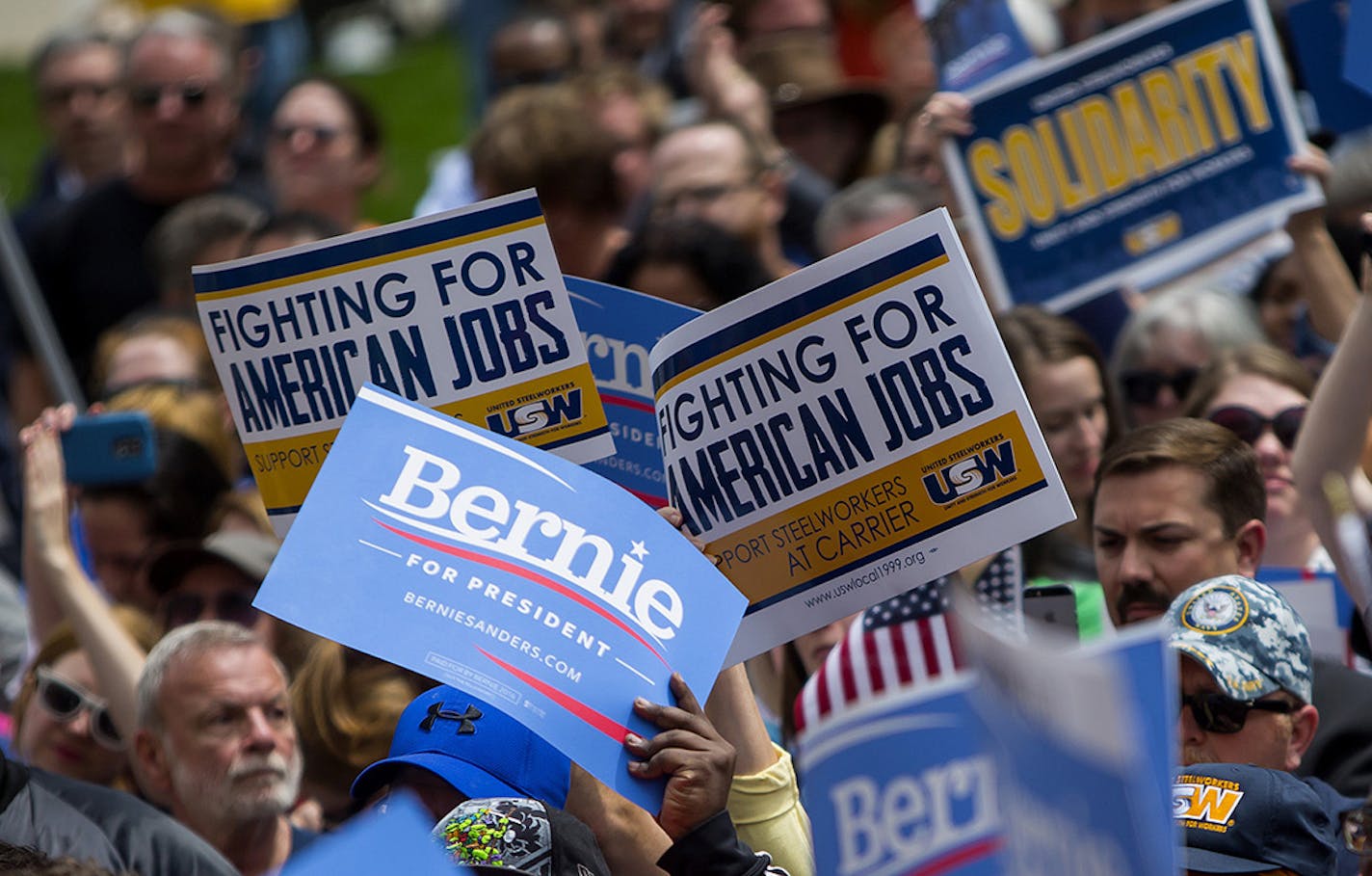 A crowd of protesters and supporters outside the Statehouse, where Sen. Bernie Sanders of Vermont, a Democratic presidential hopeful, spoke, in Indianapolis, April 29, 2016. The demonstration was to protest Carrier Corporation&#xed;s recent decision to move more than a thousand local jobs to Mexico. (Eric Thayer/The New York Times) ORG XMIT: MIN2016050614065823