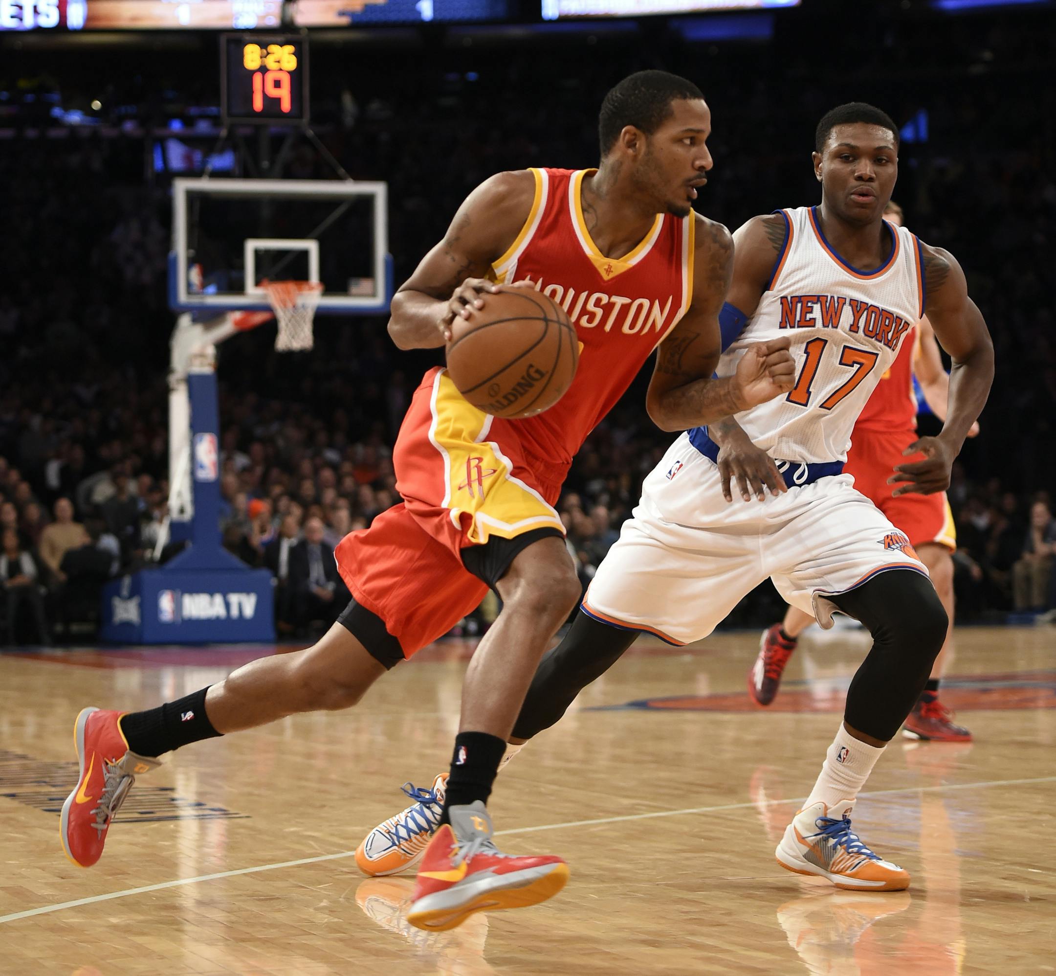 Houston Rockets forward Trevor Ariza, left, drives the ball past New York Knicks forward Cleanthony Early (17) in the first half of an NBA basketball game on Thursday, Jan. 8, 2015, in New York. The Rockets won 120-96. (AP Photo/Kathy Kmonicek)