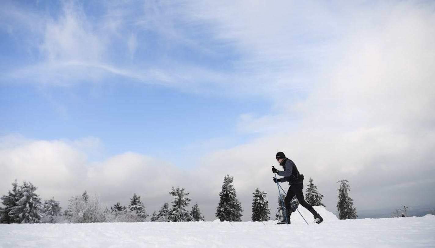 A skier makes his way through the snow on Grosser Feldberg mountain, near Schmitten in the Frankfurt area, central Germany, Saturday. Nov. 12, 2016. Snow is expected a lot closer to home in Minnesota later this week.