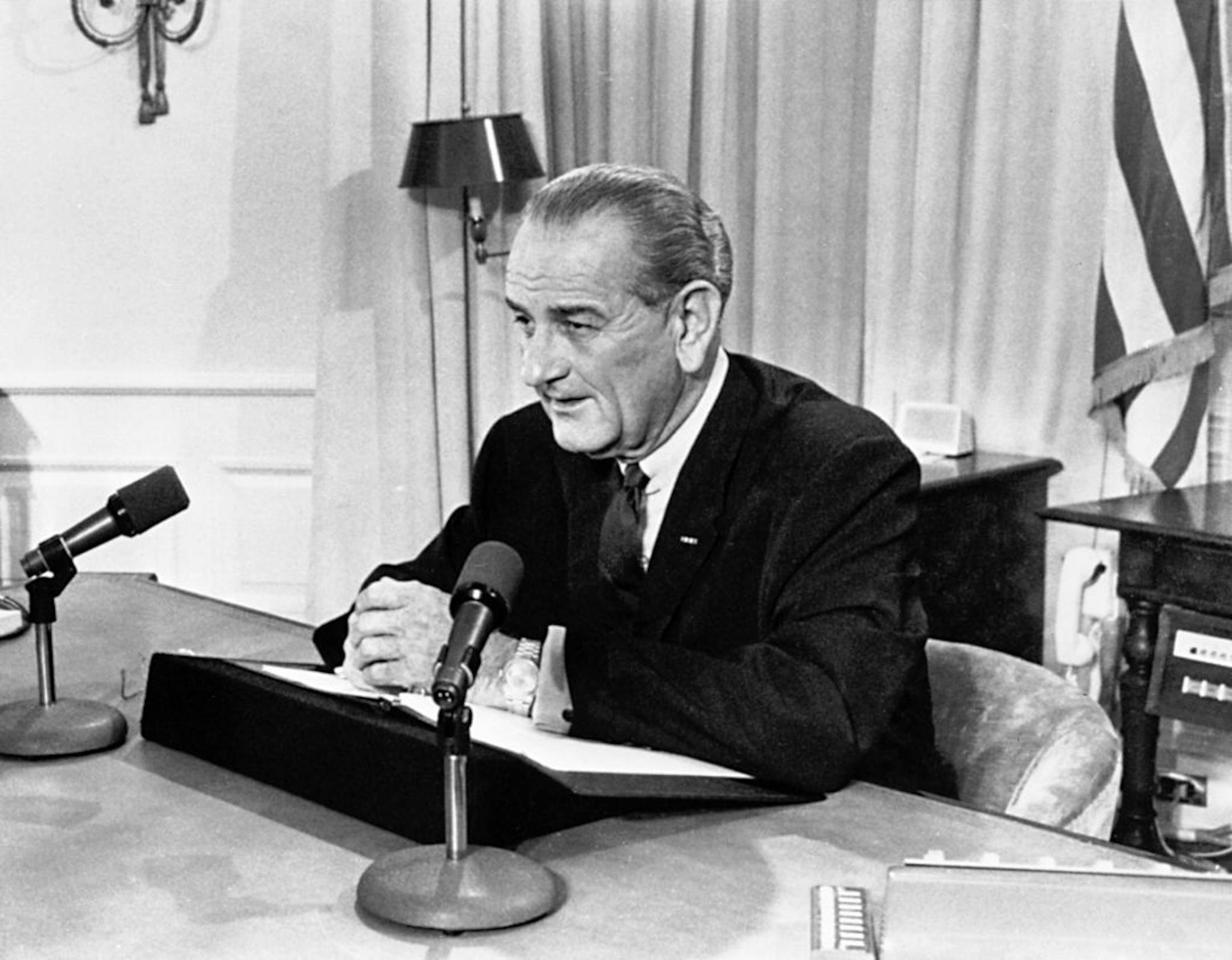 President Lyndon Johnson tells a nationwide audience that he would not seek nor accept "the nomination of my party for another term as your president," March 30, 1968, from his White House office.