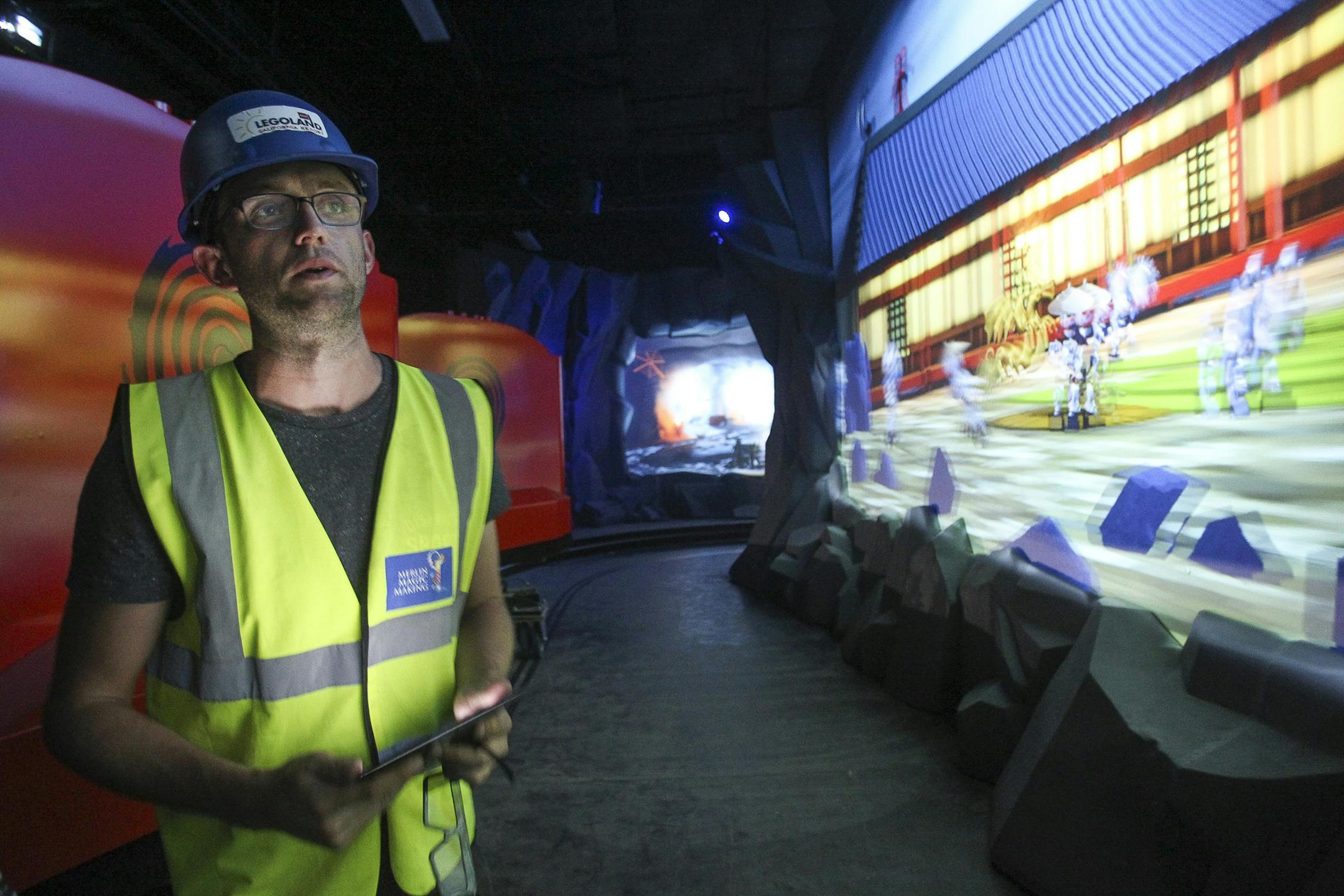 Project manager Chris Brzezicki looks at 3D projections that children will be able to interact with while on the Ninjago the Ride on April 27, 2016 at Legoland in Carlsbad, Calif. (Hayne Palmour IV/San Diego Union-Tribune/TNS)