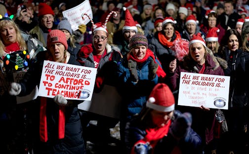Union members, teachers and supporters cheered during a rally held by Education Minnesota outside the Anoka-Hennepin district headquarters Monday, December 11, 2023, in Anoka, Minn. ] CARLOS GONZALEZ • carlos.gonzalez@startribune.com