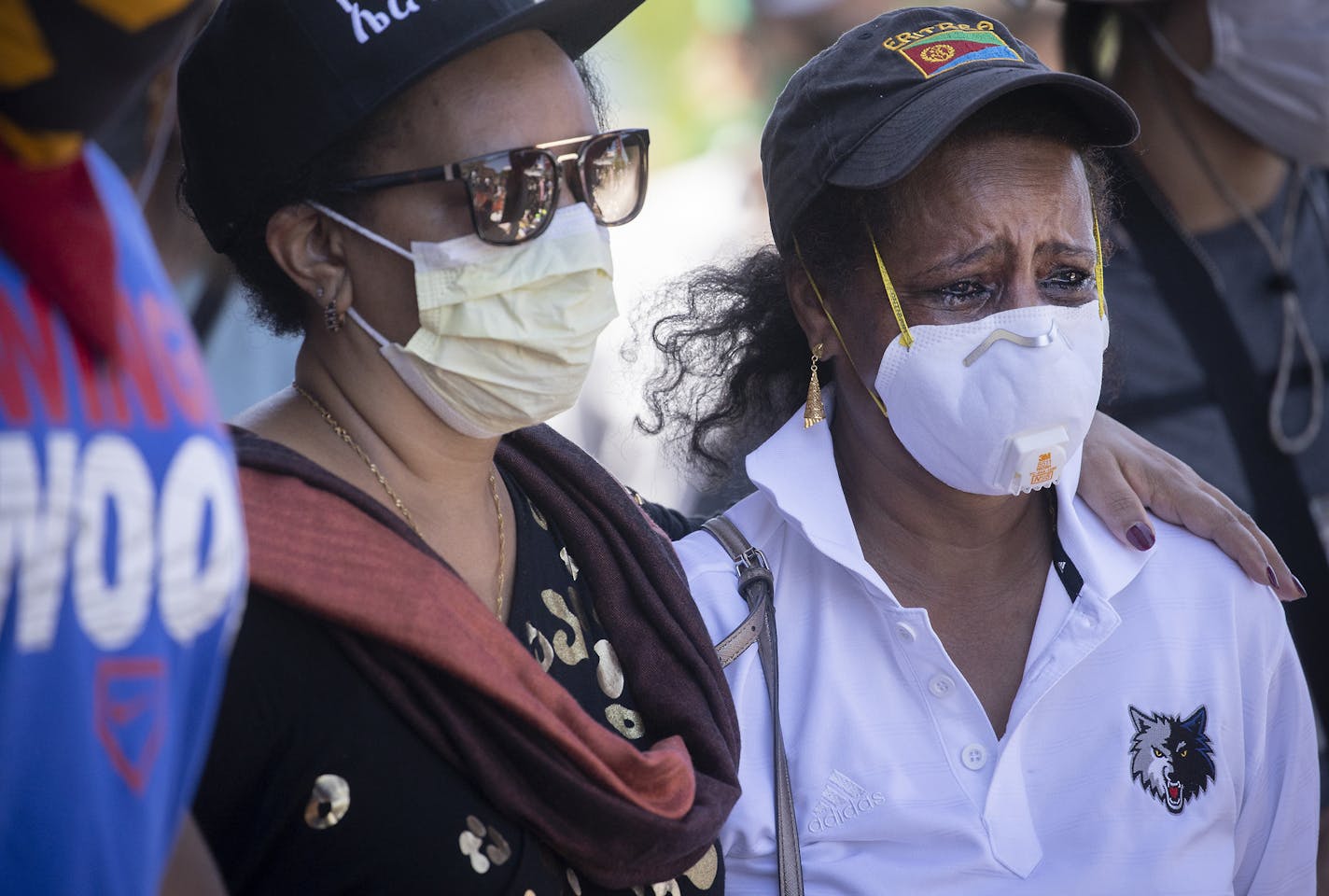 People watched and became emotional as Nationally renowned civil rights attorney Ben Crump, spoke and stood in solidarity with George Floyd's son Quincy Mason Floyd as they addressed the media at the site where Floyd was killed, Wednesday, June 3, 2020. ] ELIZABETH FLORES • liz.flores@startribune.com