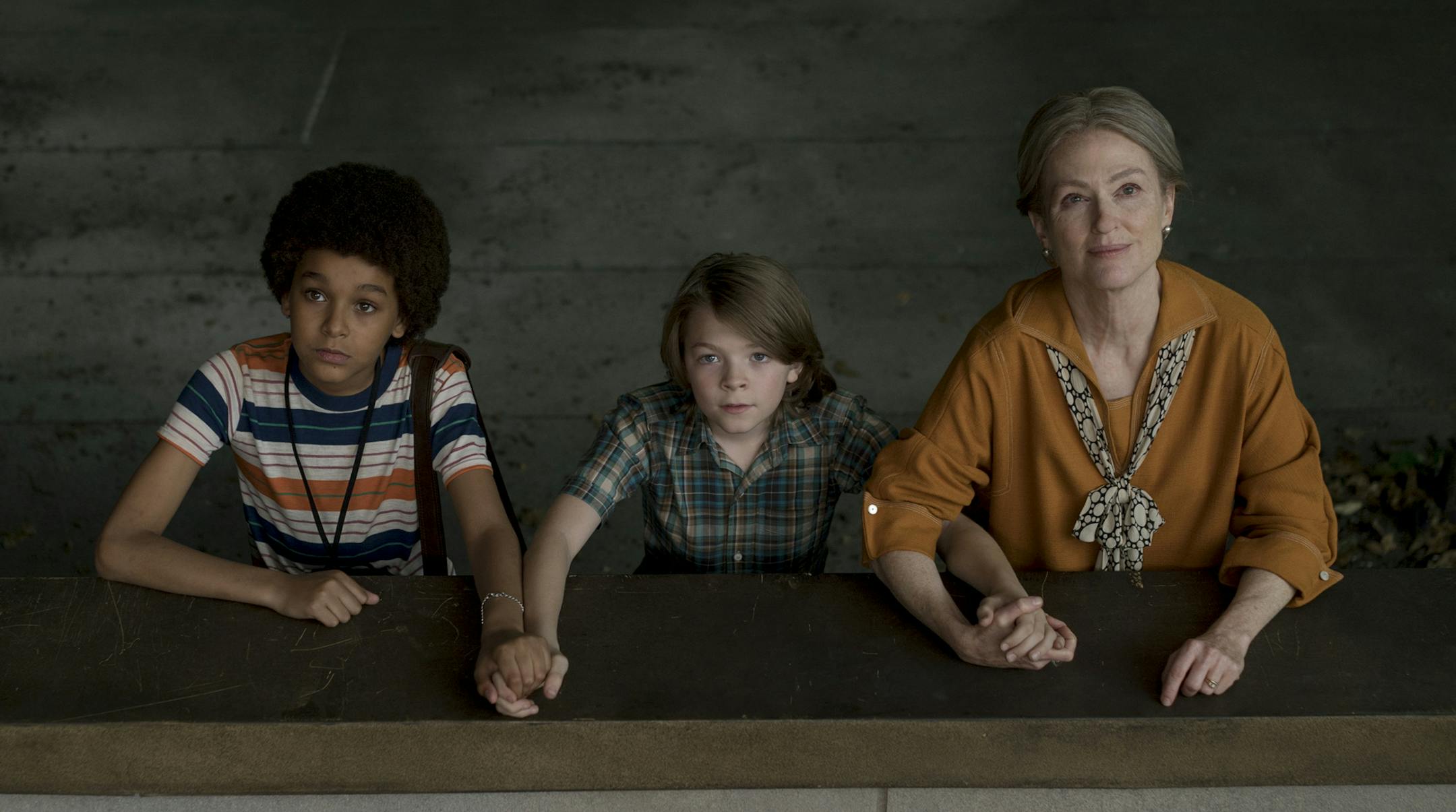 This image released by Roadside Attractions shows Jaden Michael, from left, Oakes Fegley and Julianne Moore in a scene from "WonderStruck," which was featured at the Cannes Film Festival. (Mary Cybulski/Roadside Attractions via AP)