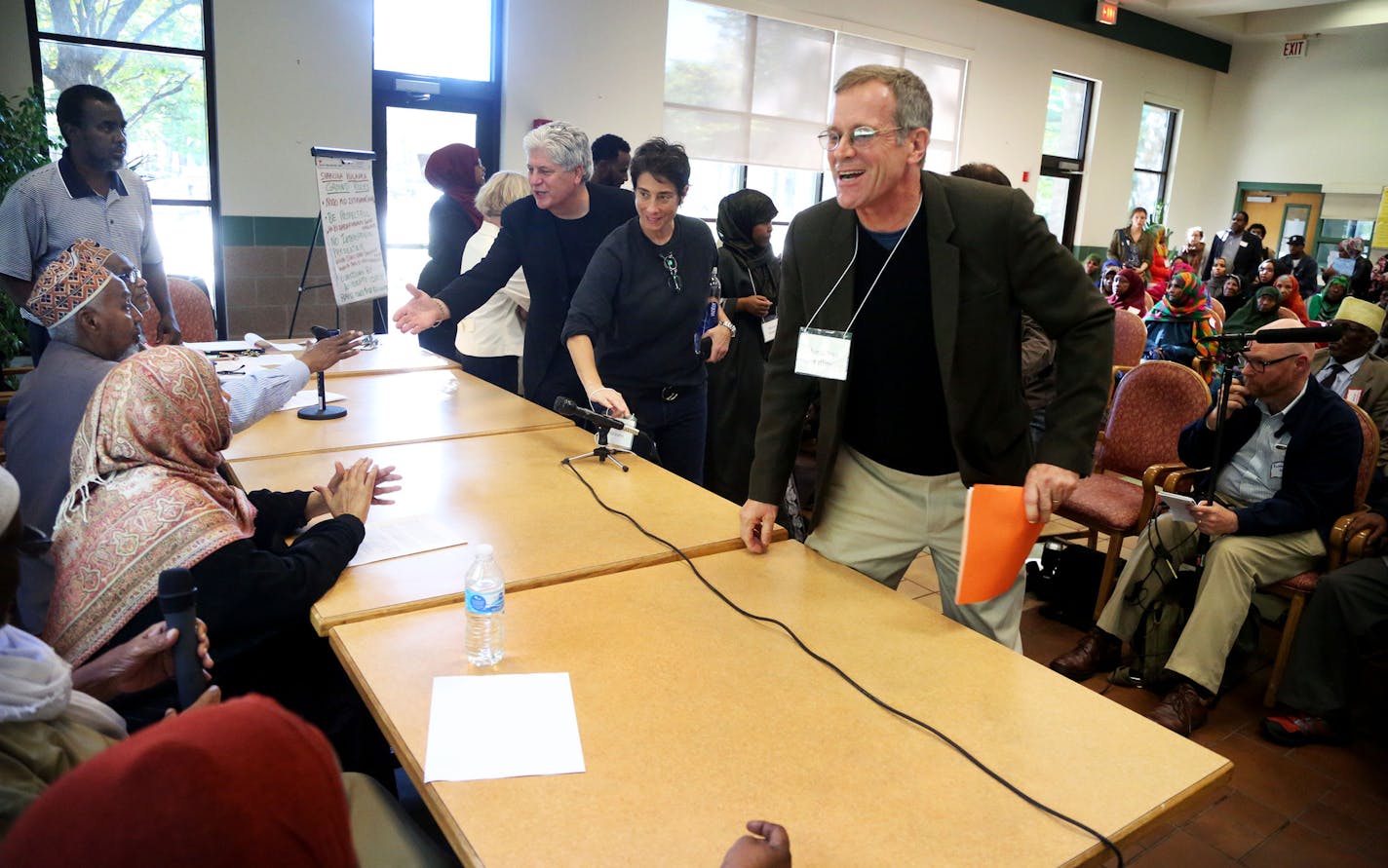 The Resident Council of the Cedars building met to hear arguments on both sides of debate over whether to allow a controversial HBO show to film on the property Wednesday, Oct. 5, 2016, in Minneapolis, MN. Here, after pitching Mogadishu, Minnesota" to those gathered, HBO producer Jonathan Filley, front right, thanked members of the Resident Council as he abruptly exited the meeting with other HBO officials after discussion got heated. The vote was 51-0 in opposition to HBO's proposal to film sce