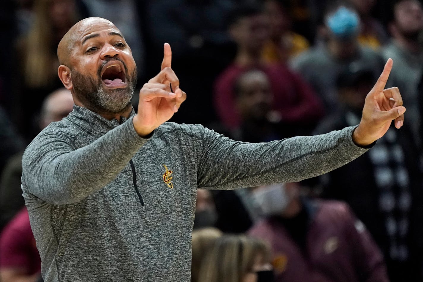 Cleveland Cavaliers head coach J.B Bickerstaff gives instructions to players in the second half of an NBA basketball game against the Miami Heat, Monday, Dec. 13, 2021, in Cleveland. The Cavaliers won 105-94. (AP Photo/Tony Dejak)